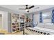 Bedroom featuring hardwood floors and shelving filled with shoes at 3099 Balearic Se Dr, Marietta, GA 30067