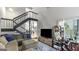 Inviting living room featuring a cozy couch, TV, and staircase to the second floor at 3099 Balearic Se Dr, Marietta, GA 30067