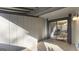 A covered patio featuring tile flooring, neutral exterior, and a view through the sliding glass doors at 3099 Balearic Se Dr, Marietta, GA 30067