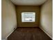 Cozy bedroom showcasing carpeting and a bay window offering ample natural light and street view at 1908 S Columbia Pl, Decatur, GA 30032
