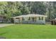 Charming single-story home featuring a well-manicured lawn and inviting front porch at 1908 S Columbia Pl, Decatur, GA 30032