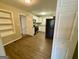 Modern kitchen featuring white cabinets, stainless steel appliances, and new floors at 1908 S Columbia Pl, Decatur, GA 30032