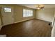 Bright living room featuring new flooring, a modern ceiling fan, and neutral paint at 1908 S Columbia Pl, Decatur, GA 30032