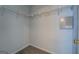 Walk-in closet with white wire shelving system for optimal storage and organization at 6380 Winston Trce, Mcdonough, GA 30252