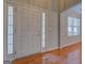 Bright foyer featuring wood floors and a window at 6380 Winston Trce, Mcdonough, GA 30252