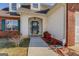 Welcoming front entrance with covered porch and landscaping provides easy access to the home at 6380 Winston Trce, Mcdonough, GA 30252
