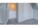 Hallway featuring carpet and access to multiple rooms at 6380 Winston Trce, Mcdonough, GA 30252