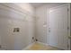 Functional laundry room with shelving, utility connections, and a door to the outside at 6380 Winston Trce, Mcdonough, GA 30252