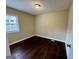 A cozy bedroom with dark wood floors and neutral-toned walls, offering a clean, bright space at 2194 Loring Ct, Decatur, GA 30032