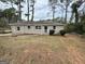Traditional single-story home with white trim, mature trees, and inviting curb appeal at 2194 Loring Ct, Decatur, GA 30032