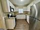 Well-lit kitchen with white cabinets, stainless steel appliances, and granite countertops at 2194 Loring Ct, Decatur, GA 30032