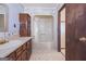 Bathroom featuring a vanity with storage, mirror, sink, and access to the tub and shower combination at 94 Gilley Rd, Carrollton, GA 30116