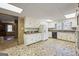 Kitchen with classic white cabinets and black appliances, with an adjacent space providing flexible options at 94 Gilley Rd, Carrollton, GA 30116