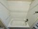 Classic bathroom featuring a tub with tiled walls and updated fixtures at 1145 Penn Se Ct, Atlanta, GA 30315