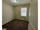Cozy bedroom with natural light and plush carpeting at 1145 Penn Se Ct, Atlanta, GA 30315