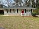 Inviting single-story house with a red front door and freshly painted facade at 1145 Penn Se Ct, Atlanta, GA 30315