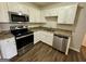 Well-equipped kitchen with stainless steel appliances and classic cabinetry at 1145 Penn Se Ct, Atlanta, GA 30315