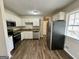Renovated kitchen with stainless steel appliances and granite countertops at 1145 Penn Se Ct, Atlanta, GA 30315