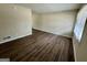 Open living space with vinyl floors, neutral walls, and a view from the entrance at 1145 Penn Se Ct, Atlanta, GA 30315