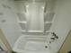 Clean white shower with built-in shelving and chrome fixtures at 1145 Penn Se Ct, Atlanta, GA 30315