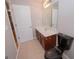 Bathroom features a dark wood vanity, a black toilet, and tile flooring at 5120 Redcoat Ln, Mcdonough, GA 30252
