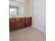 Bathroom with a double sink vanity with wood cabinets and a large mirror at 5120 Redcoat Ln, Mcdonough, GA 30252