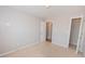Bright bedroom featuring neutral walls, carpeted floors, and a closet at 5120 Redcoat Ln, Mcdonough, GA 30252