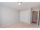 Neutral bedroom featuring a closet with double doors and carpeted flooring at 5120 Redcoat Ln, Mcdonough, GA 30252