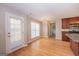 Open dining area with modern chandelier and hardwood floors at 5120 Redcoat Ln, Mcdonough, GA 30252
