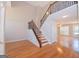 Spacious foyer with hardwood floors, an elegant staircase with iron balusters, and an open layout at 5120 Redcoat Ln, Mcdonough, GA 30252