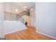Open foyer showcases hardwood floors, a staircase with iron balusters, and a view of the living spaces at 5120 Redcoat Ln, Mcdonough, GA 30252