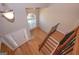 Bright foyer with hardwood floors, a staircase, and a large arched window above the front door at 5120 Redcoat Ln, Mcdonough, GA 30252
