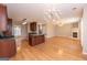 Open kitchen with stainless appliances and view to dining room with fireplace at 5120 Redcoat Ln, Mcdonough, GA 30252