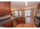 Open concept kitchen with stainless appliances and views of the dining room with fireplace at 5120 Redcoat Ln, Mcdonough, GA 30252