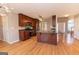 Open floor plan featuring kitchen with island and view into the living room and entry at 5120 Redcoat Ln, Mcdonough, GA 30252