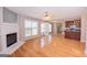 Spacious living room with hardwood floors, fireplace, and open to the kitchen at 5120 Redcoat Ln, Mcdonough, GA 30252