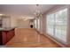 Spacious living room featuring hardwood floors, a fireplace, and large windows at 5120 Redcoat Ln, Mcdonough, GA 30252