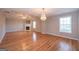 Spacious living room features a fireplace and a chandelier at 5120 Redcoat Ln, Mcdonough, GA 30252