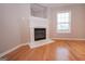 Cozy fireplace highlighted by hardwood floors in the living room at 5120 Redcoat Ln, Mcdonough, GA 30252