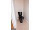 A close-up of a black toilet in a half bathroom featuring tile flooring at 5120 Redcoat Ln, Mcdonough, GA 30252