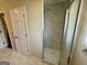 Bathroom featuring tiled shower with glass door at 5319 Orly Ter, South Fulton, GA 30349