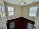 Well-lit bedroom featuring hardwood floors and two windows at 5319 Orly Ter, South Fulton, GA 30349