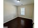 Bright bedroom with hardwood floors and a window at 5319 Orly Ter, South Fulton, GA 30349