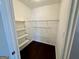 Walk-in closet with shelving and hardwood floor at 5319 Orly Ter, South Fulton, GA 30349