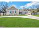 Beautifully landscaped single-story home with brick facade and long driveway at 5319 Orly Ter, South Fulton, GA 30349
