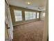 Bright and airy living room with carpet, ceiling fan, and multiple windows at 5319 Orly Ter, South Fulton, GA 30349