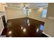Inviting living room features hardwood floors, fireplace, and a ceiling fan at 5319 Orly Ter, South Fulton, GA 30349