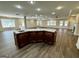 Large open concept living space with center island and hardwood floors at 5319 Orly Ter, South Fulton, GA 30349