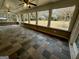 Spacious enclosed sunroom with tiled flooring and scenic backyard views at 5319 Orly Ter, South Fulton, GA 30349