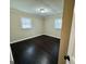 Bright bedroom with hardwood floors, crown molding, and two large windows at 230 Argus Cir, Atlanta, GA 30331